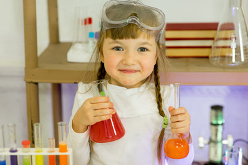 young girl making science experiments