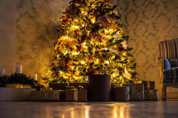 Classic green tree decorated in christmas toys. Merry christmas and new year interior background.