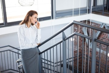 Fototapeta premium Businesswoman talking on smartphone