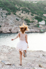 Portrait of the beautiful girl on nature
