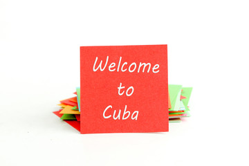 red note paper with text welcome to cuba