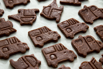 cutting cookies dough cars shape. homemade bakery