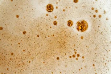 Fotobehang Close up image of beer bubbles. © tonovavania