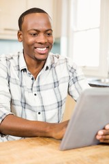 Handsome man using tablet