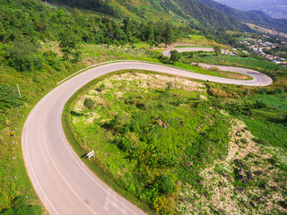 Aerial view of crooked path of road on the mountain, Shot from d