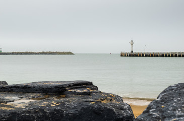 Fototapeta na wymiar Beach in Ostend and lighthouse, Belgium