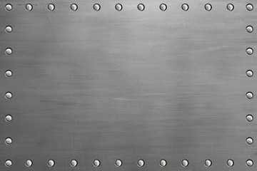 Polished metal plate with rivets