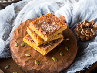 Winter pumpkin spiced blondies on wooden board