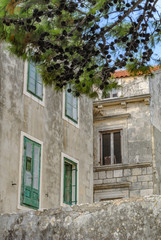 Korčula architecture detail. Facade with windows.