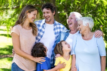 Smiling family hugging
