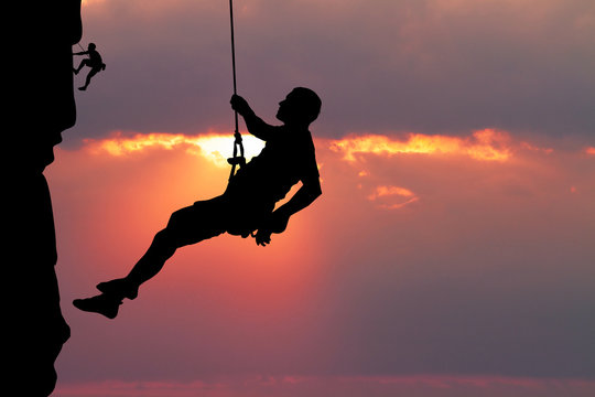 free climber at sunset