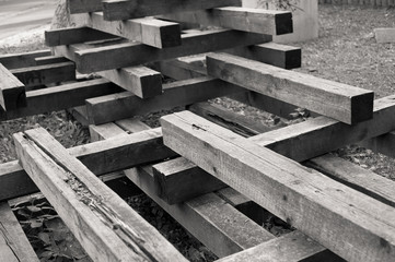 Construction made of wooden squared planks as abstract object. Black and white