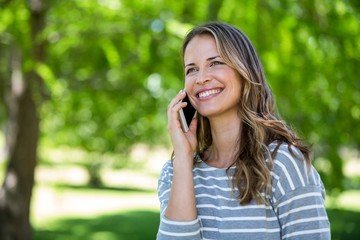 Smiling woman making a phone call