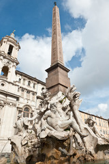 Fototapeta na wymiar Fontana dei Quattro Fiumi (Fountain of the Four Rivers) and Sant' Agnese in Agone, Piazza Navona, Rome, Italy