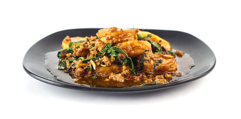 Dish of stir fried eggs tofu with pork  and holy basil