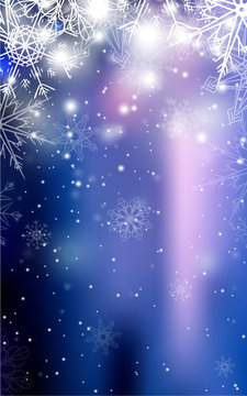 Blurred blue Christmas winter background with sparkles and snowflakes.