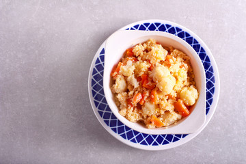 cauliflower and carrot couscous in a bowl