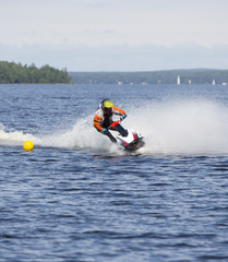 Water jet ski running fast in the water and splashing. Also known as personal water craft. 