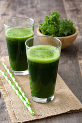 Smoothie with kale in glass on wooden background.Copyspace

