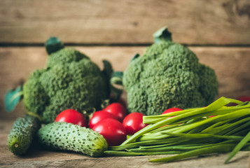 Fresh Raw Broccoli, Cheery tomatoes and cucumbers.Vegetables