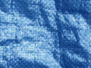 blue color plastic bag surface with blur effect.