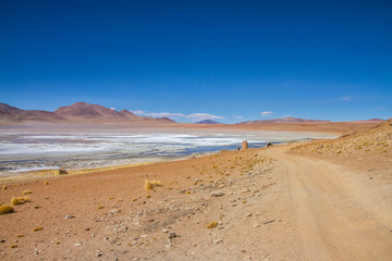 Fototapeta na wymiar Desert and mountain over blue sky and white clouds on Altiplano,Bolivia Chile 