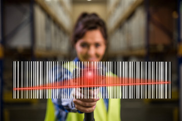 Concept photo of a woman scanning a bar code with a hand scanner in a warehouse. Traceability, FIFO, LIFO, just in time concept photo. - obrazy, fototapety, plakaty