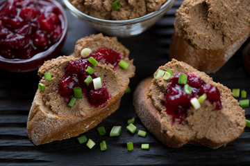Chicken liver pate sandwiches with cranberry sauce, close-up