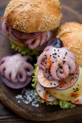 Burgers with pulpo a la gallega, close-up, selective focus