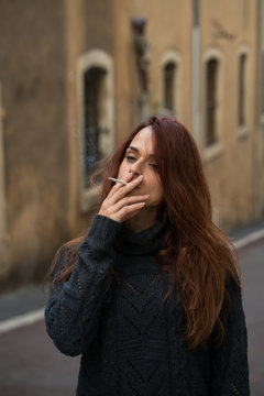 Young pretty woman smoking