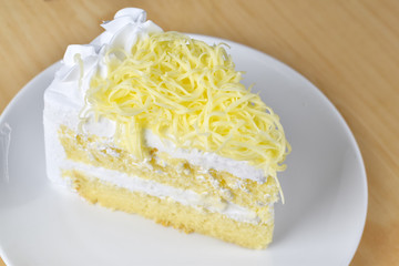 piece of cake with whip cream and grated cheese topping,selectiv