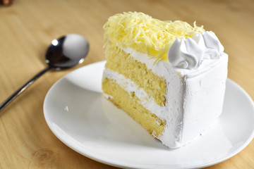piece of cake with whip cream and grated cheese topping,selectiv