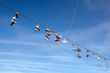 boots, shoes, sneakers, shoes weighing on the rope, flash mob, installation, the townspeople joke