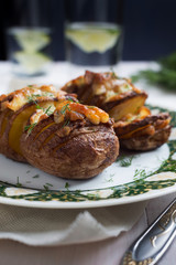 Baked potatoes with cheese and dill