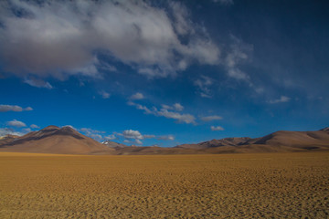 Desert and mountain over blue sky and white clouds on Altiplano,Bolivia Chile