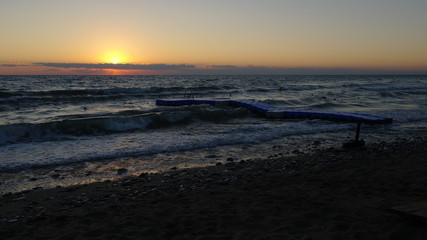 A perfect sunrise over an agitated sea