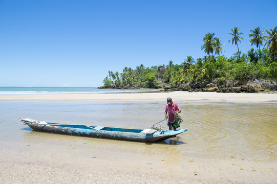 Traditional Brazilian dugout fishing boat on the beach in Bahia, Nordeste, Brazil