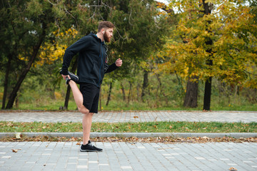 Fototapeta premium Full length runner warming up