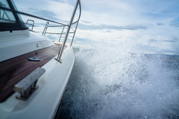 Powerboat battles an ocean storm - obrazy, fototapety, plakaty