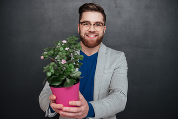 Smiling hipster with flower