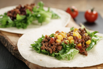 open tortilla with beef, frillice and corn, organic fastfood