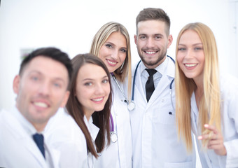Fototapeta na wymiar Smiling Team Of Doctors At Hospital Making Selfie