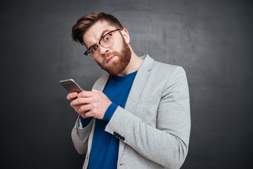 Funny hipster with phone
