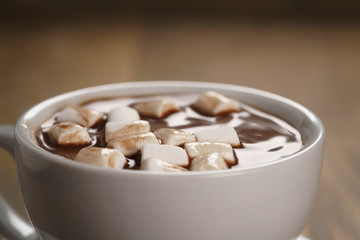 cup of homemade hot chocolate with marshmallows, shallow focus