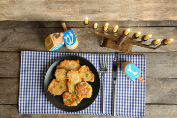 Beautiful composition for Hanukkah on wooden table