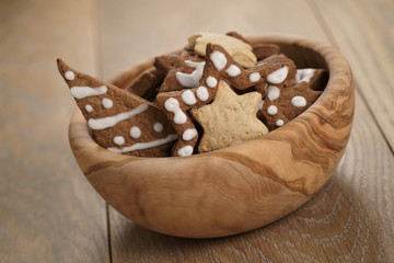 chrismas chocolate cookies in wooden bowl on oak table, holliday dessert