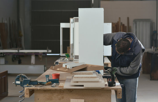 Carpenter working on a furniture piece