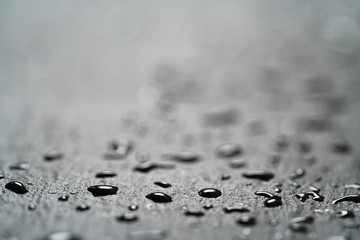 slate surface with water drops macro shot, shallow focus