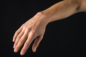 Fototapeta premium human hand showing signs. isolated on black