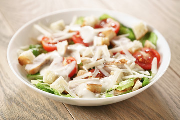 caesar salad with red cherry tomatoes, shallow focus